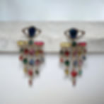 Gold statement eye earrings