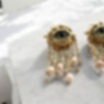 Gold evil eye earrings