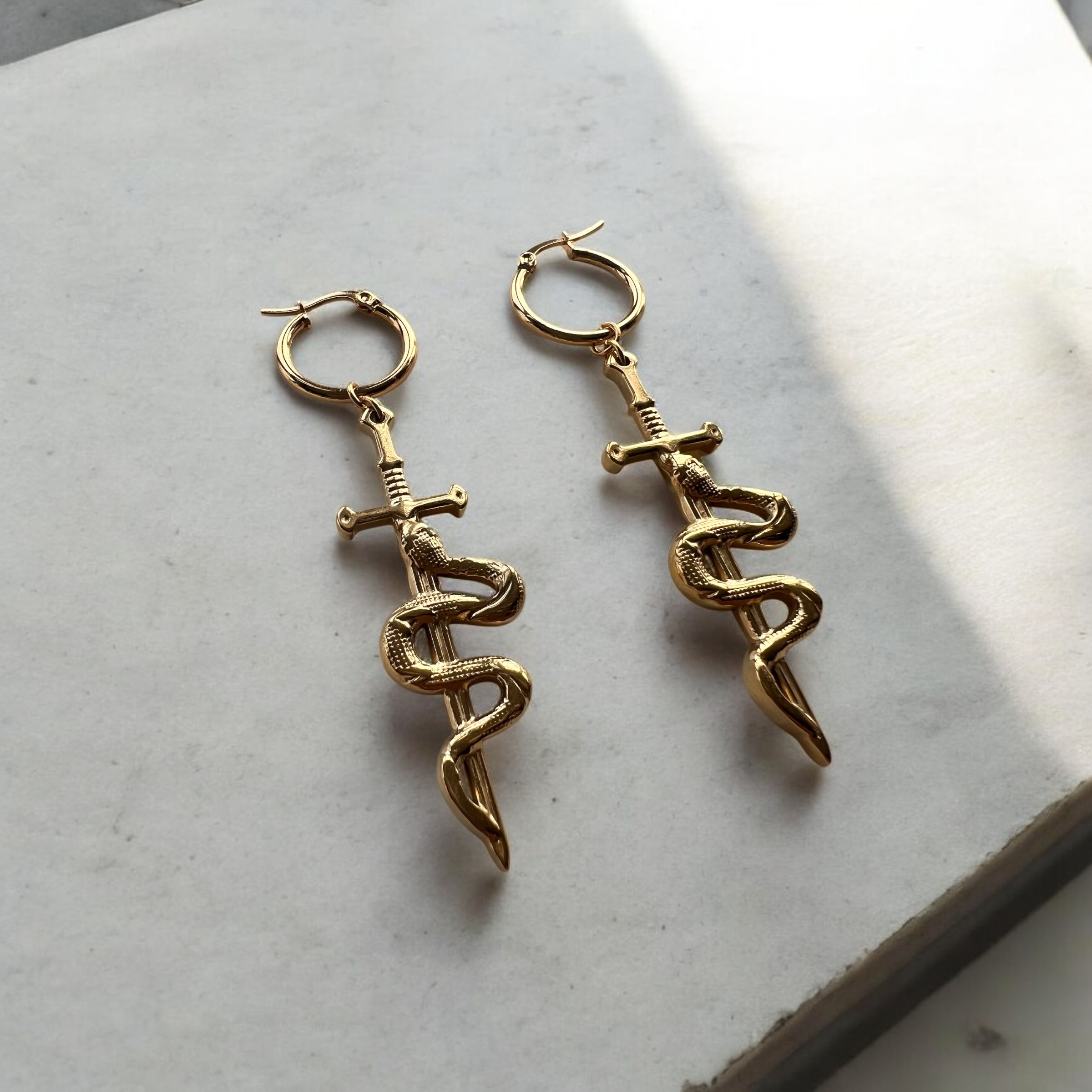 Sword and snake earrings gold