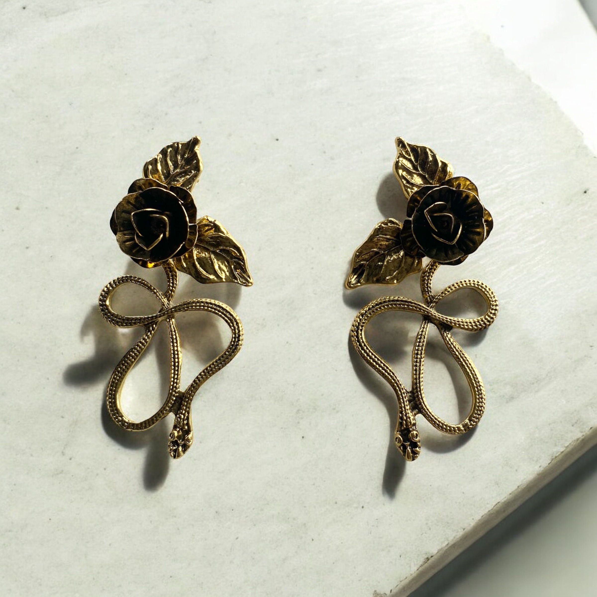 Rose and snake earrings
