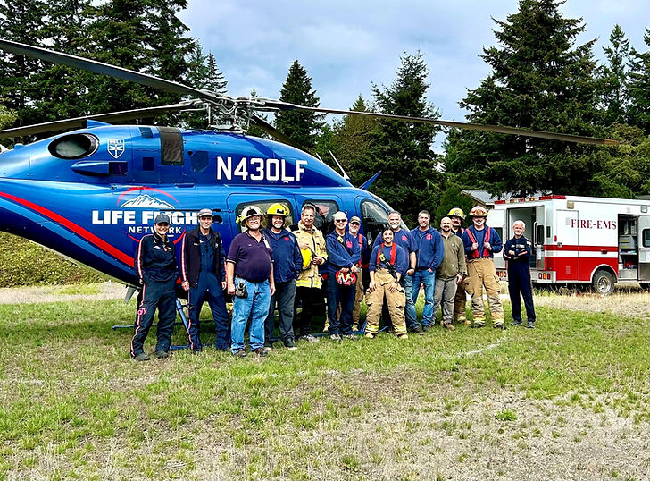 Fire Department personnel infront of rescue chopper
