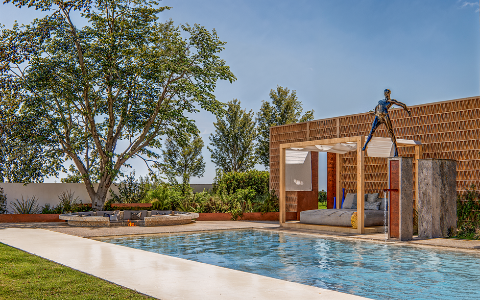 3D exterior rendering of a luxury outdoor pool and lounge area with seating, fire pit, and modern pergola.