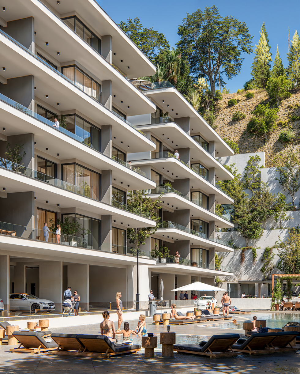 3D close-up rendering of modern residential façade with balconies and glass railings.