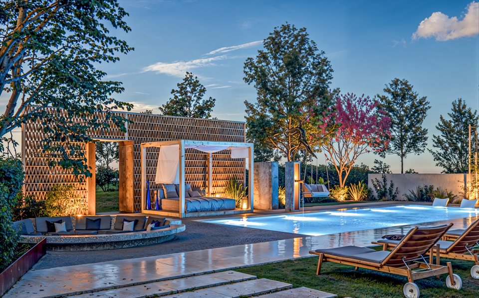 3D exterior visualization of a luxury pool area at sunset with ambient lighting.