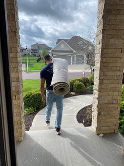 Cam carrying a rug