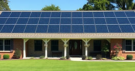 Single story large ranch style home with Solar Panels on sunny day.jpg