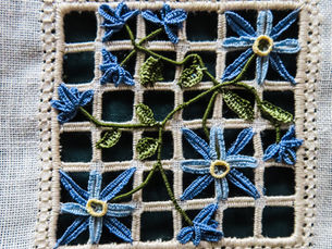 Blue floral reticello embroidery