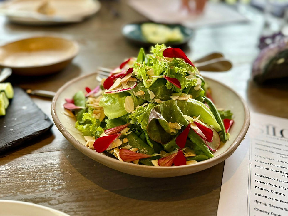 Spring Greens Salad. local greens, spring vegetables, almonds, citrus dijon vinaigrette.