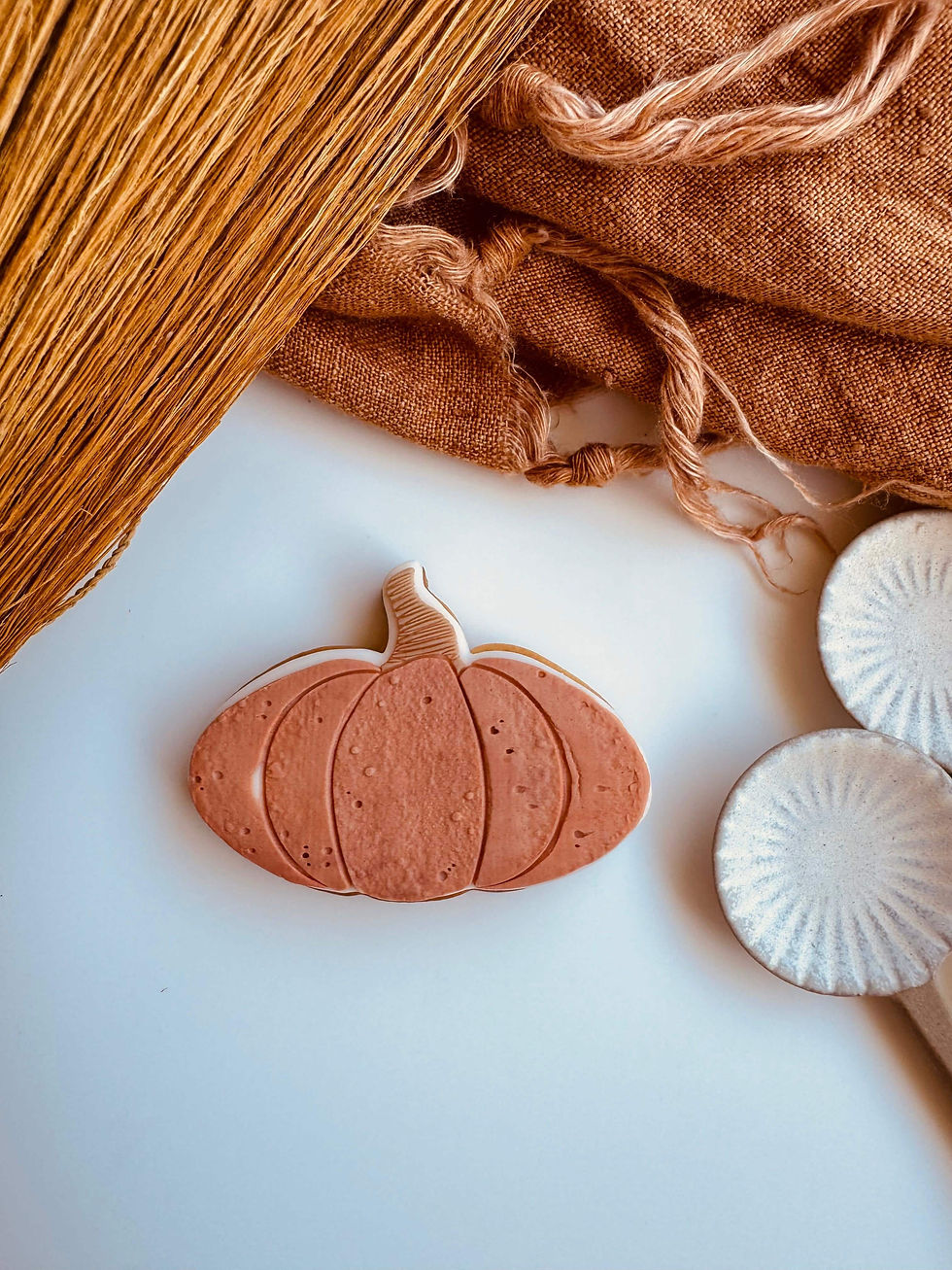 3 pumpkin cookies on a plate