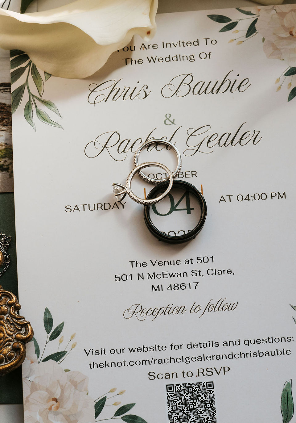 wedding invitation with bride and groom rings