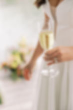 bride holding a champagne glass