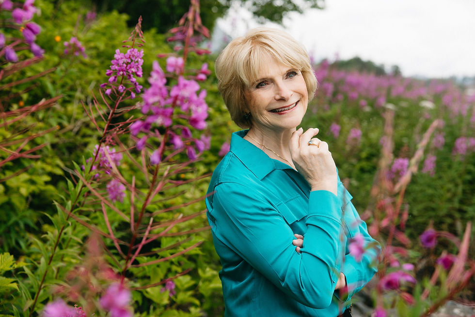 ral-west-portrait-teal-shirt-outdoor-wildflower-field.jpg
