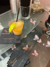 a drink on a napkin that says the night before