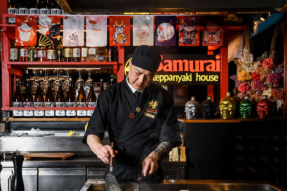 Samurai Teppanyaki House chef cooking at the teppan grill