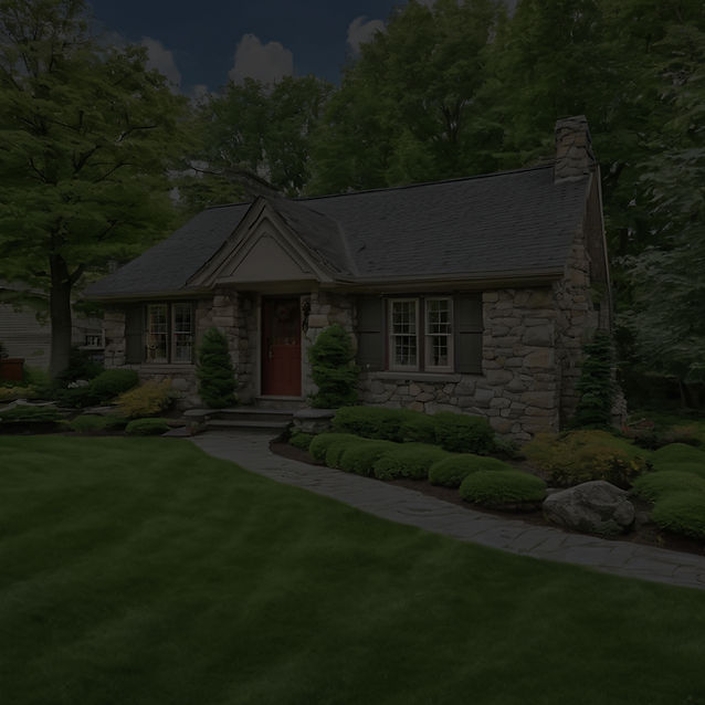 A well maintained Small stone home with a beautiful yard.jpg