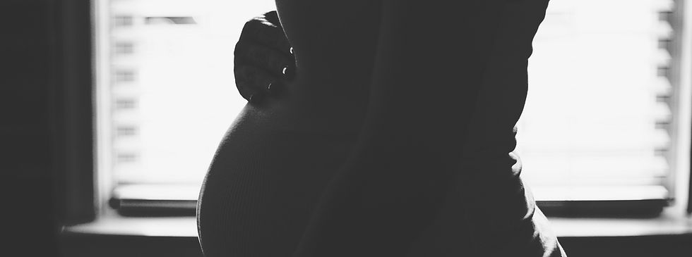 Maternity portrait in Las Vegas studio with flowing gown