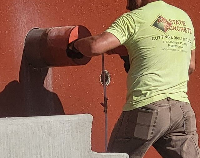 Employee core drilling a hole