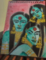 Three stylized figures with turquoise skin, adorned with gold jewelry, against a pink background. They have expressive eyes and red bindis.