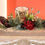 Thumbnail: Wooden centrepiece with pine cones, berries and 1 candle jar