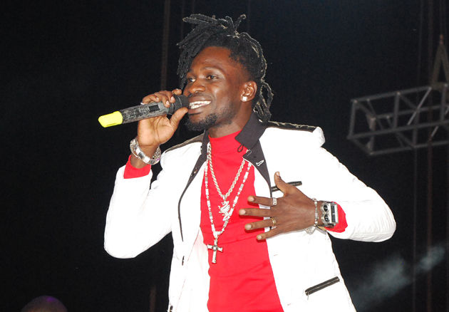 Dread-locked Bobi Wine performs for fans at a concert in Kampala.
