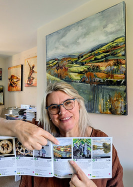 Sheryll K Fox with SOS 25 brochure