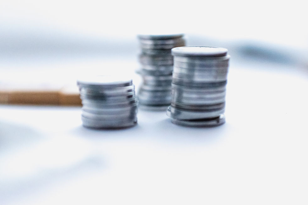 silver coins stacked together