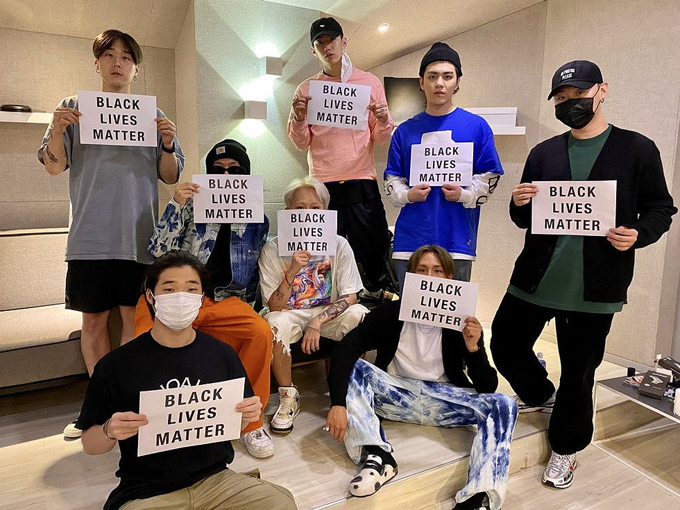 H1GHER Music Artists holding Black Lives Matter signs
