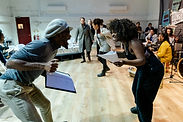 The Black Power Desk R&D cast dancing and singing in a rehearsal room at the Old Vic.