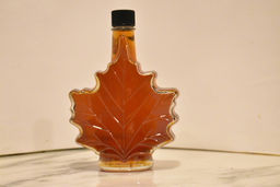 Maple leaf bottle filled with yummy Garland Sugar Shack maple syrup