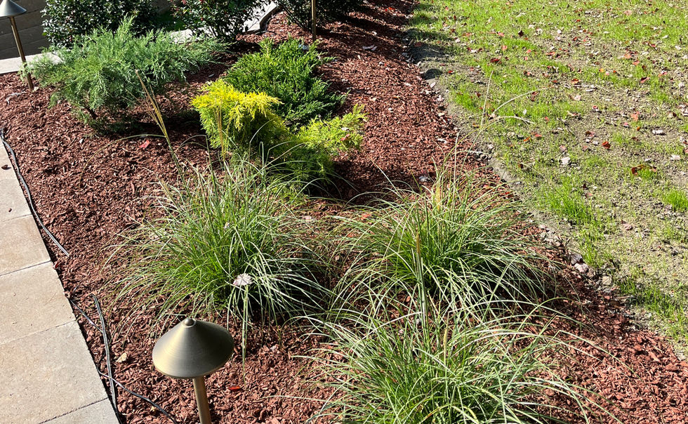 Ideal block retaining walls, and Ideal Paver patio with Granite Steps, landscape lighting and plantings in Bernardston MA