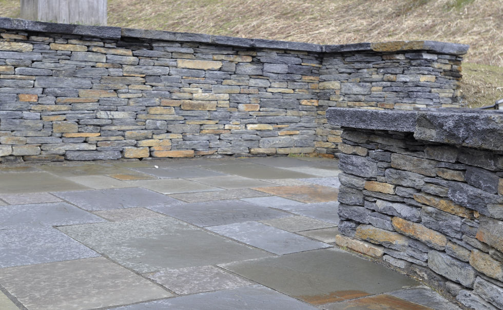 A Bluestone patio with Goshen Stone walls and Granite Steps in Charlemont, MA