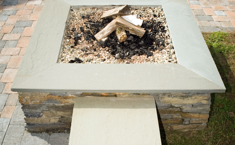 An Ideal Paver patio, with Goshen Stone walls, steps and fire pit with bluestone caps in Deerfield, MA