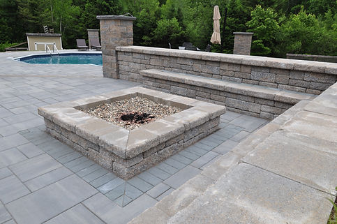A pool deck patio project with Cambridge Pavers and wall block in Deerfield, MA