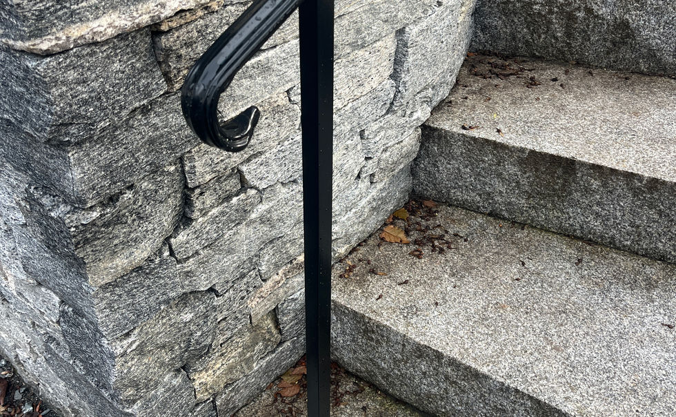 Granite veneered retaining walls and curved granite steps with custom railing, in Bernardston MA