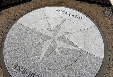 The granite compass rose on the Bridge of Flowers in Shelburne Falls, MA