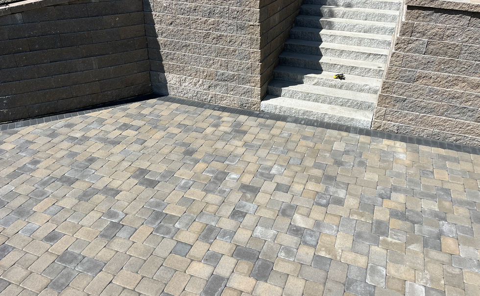 Ideal block retaining walls, and Ideal Paver patio with Granite Steps, landscape lighting and plantings in Bernardston MA