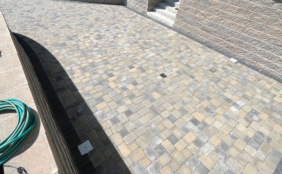 Ideal block retaining walls, and Ideal Paver patio with Granite Steps, landscape lighting and plantings in Bernardston MA