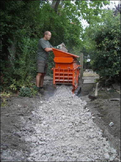 Customer laying new path, recycling the old one as a sub-base.    The machine was used to 