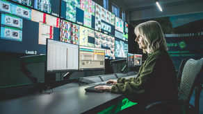 women in front of screens