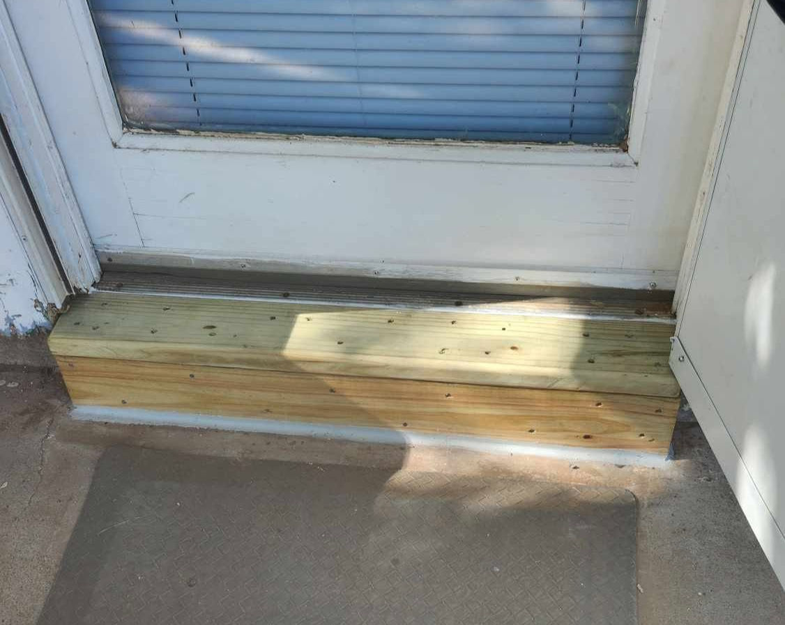 New wooden porch step built for a home repair project in Lubbock