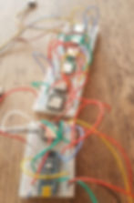 Several DFPlayer media players on a breadboard connected to an arduino microcontroller