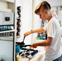 Young person cooking in a kitchen