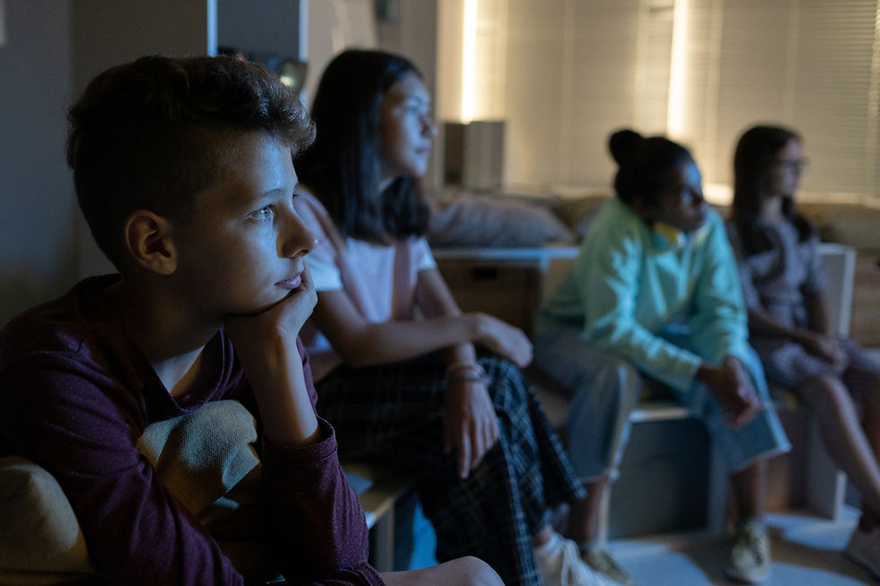 Young person watching something with adult