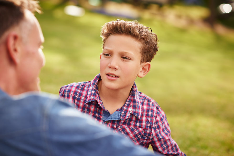 shot of a father and son talking together