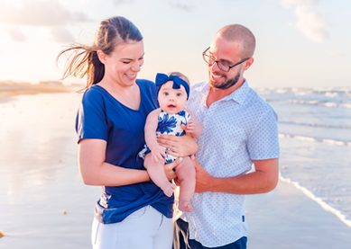 Family of 3 photographed on the beach