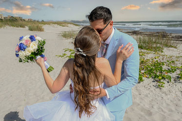 Bride and groom romantic wedding portrait by the water in Orlando