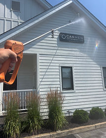Hydros Power Washing team cleaning the exterior of an orthopedic building in Pickerington, Ohio.