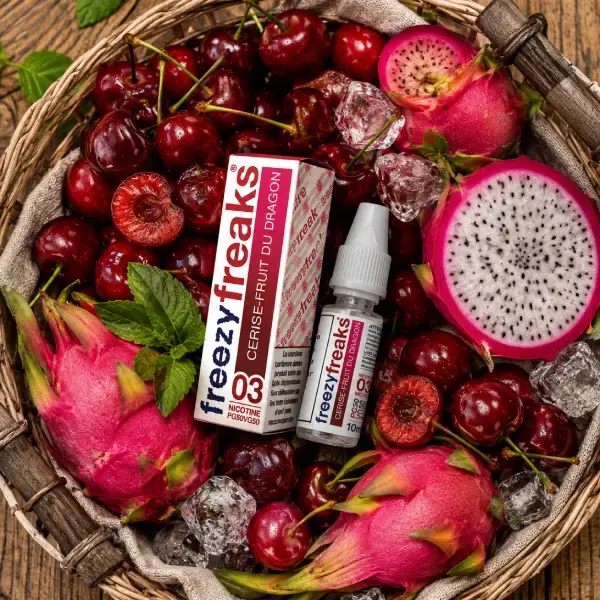 Miniature : E-liquide Cerise Fruit du Dragon Freezy Freaks 10ml de Freaks dans un panier rempli de cerises et de fruits du dragon