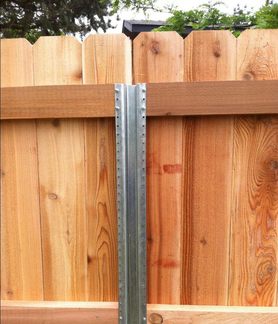 Metal Fence Post used to support privacy fence in McDonough, Georgia.