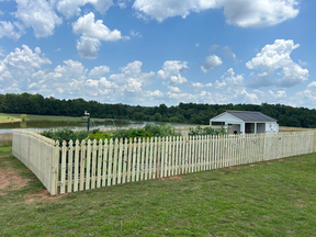 Wooden Picket fence built around garden in Barnesville, Ga